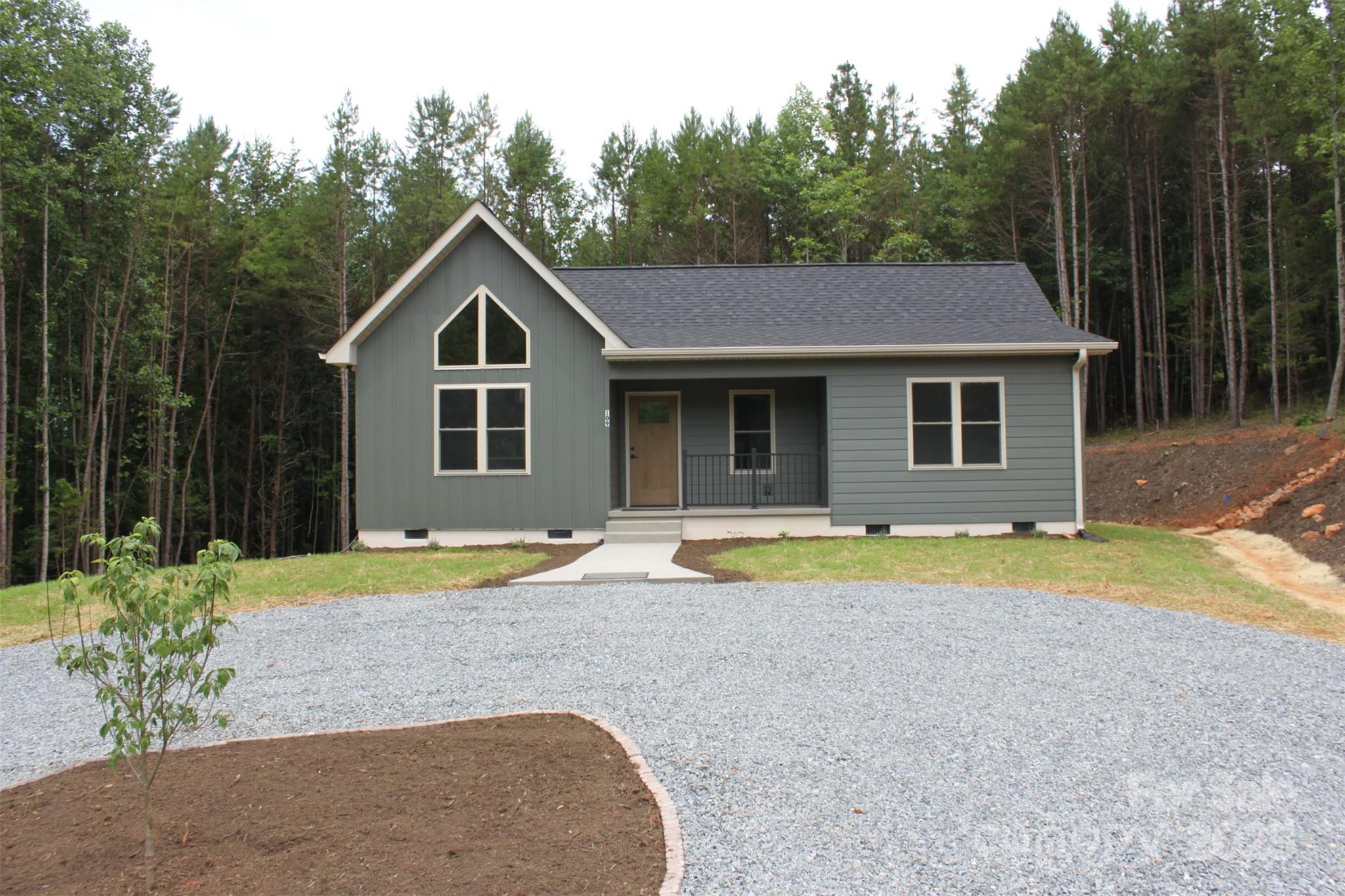 109 Blue Ridge Avenue Extension Elkin, NC 28621 - Photo 2 of 20 a house with swimming pool in front of it