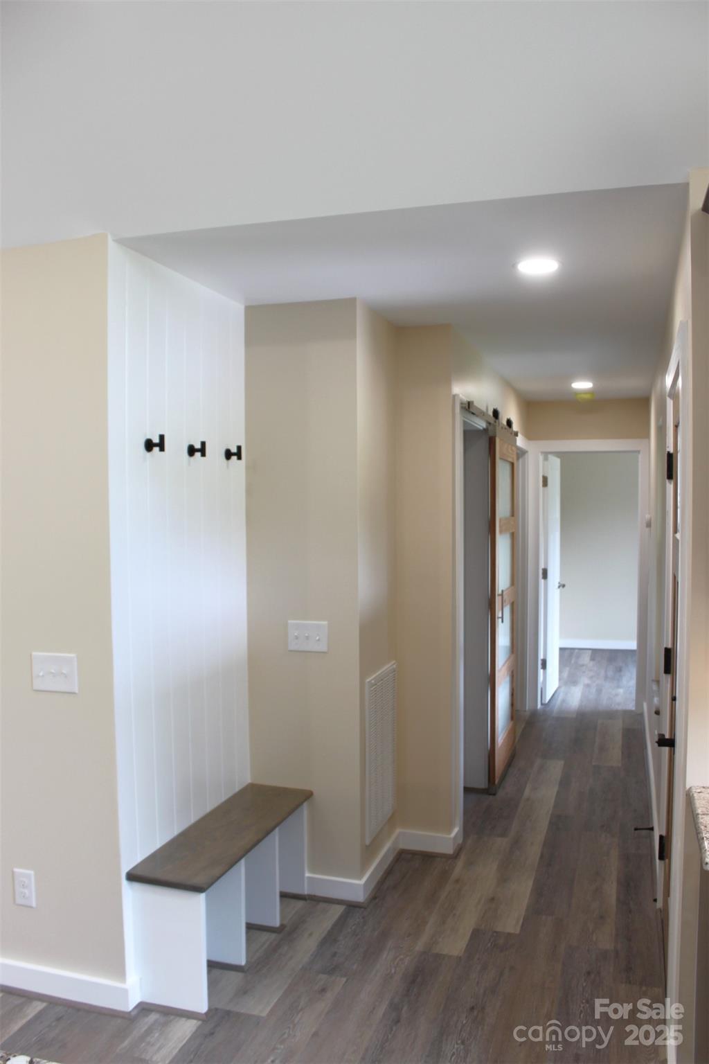 109 Blue Ridge Avenue Extension Elkin, NC 28621 - Photo 7 of 20 a view of a hallway with wooden floor