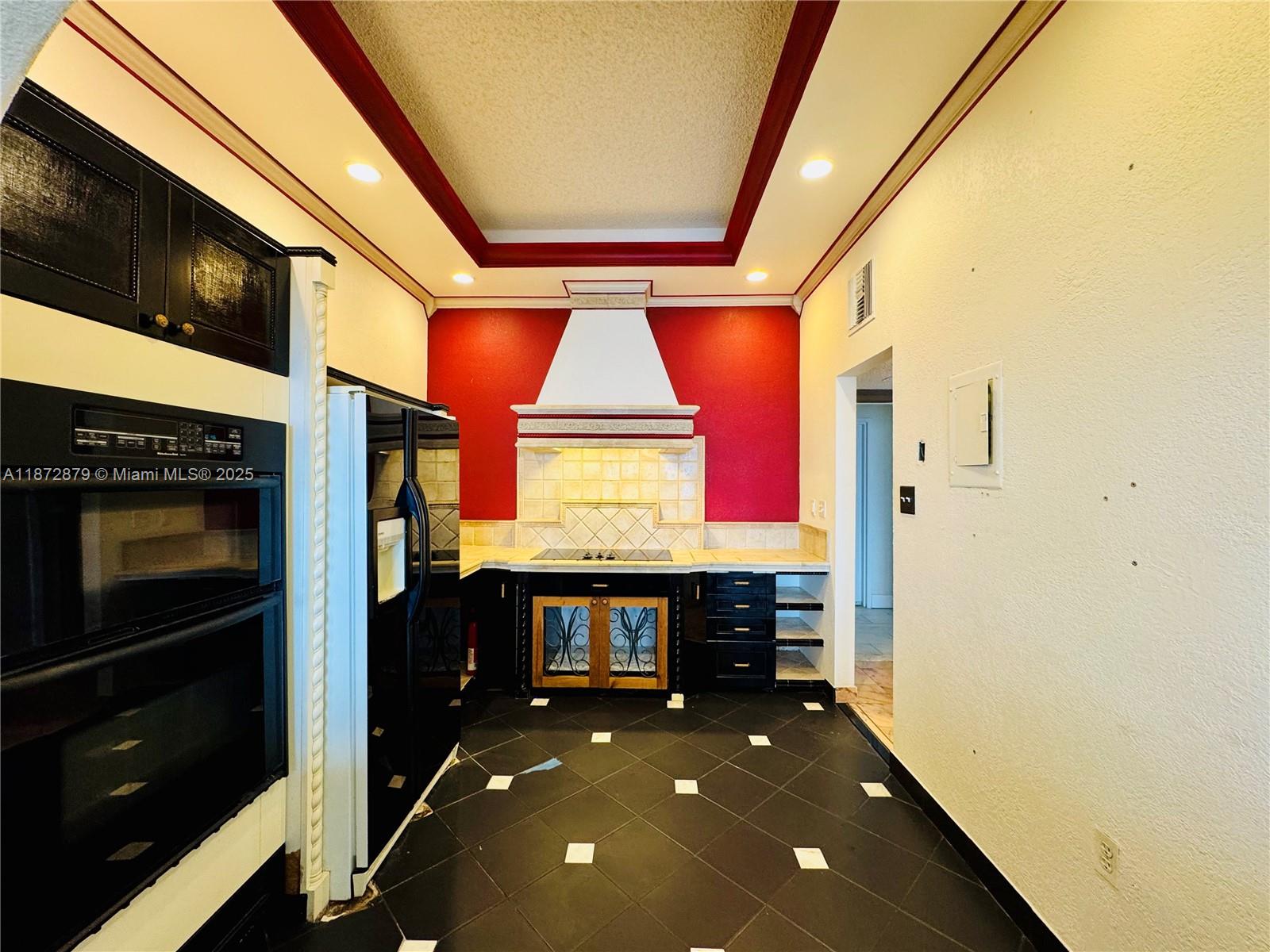 18071 Biscayne Boulevard, Unit PH04 & PH03 Aventura, FL 33160 - Photo 13 of 26 a room with stainless steel appliances kitchen island granite countertop a stove and a microwave