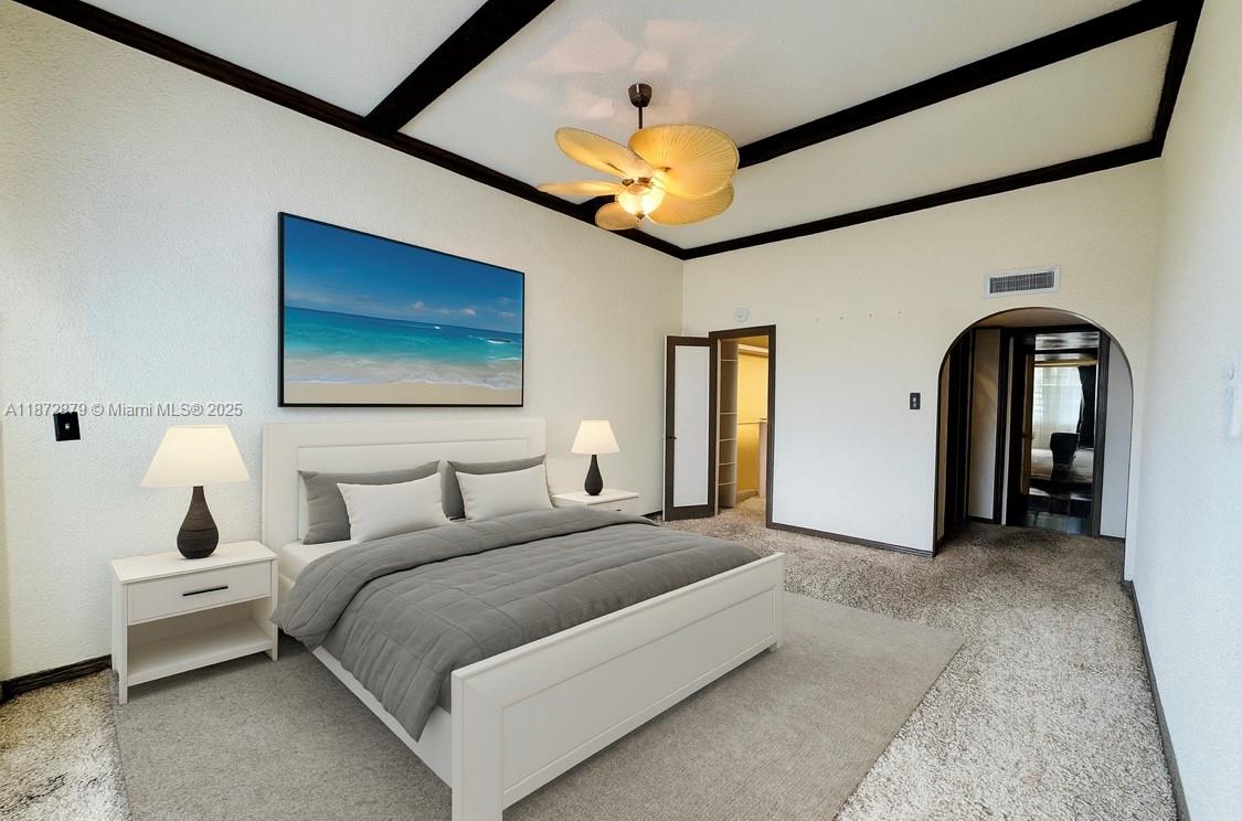 18071 Biscayne Boulevard, Unit PH04 & PH03 Aventura, FL 33160 - Photo 4 of 26 a bedroom with a bed and a chandelier