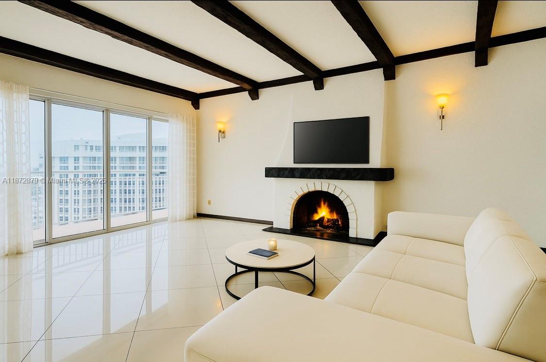 18071 Biscayne Boulevard, Unit PH04 & PH03 Aventura, FL 33160 - Photo 5 of 26 a living room with furniture and a flat screen tv