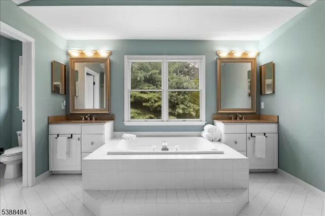 a bathroom with a bathtub and a sink