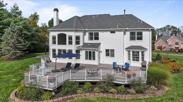 a front view of a house with a yard table and chairs
