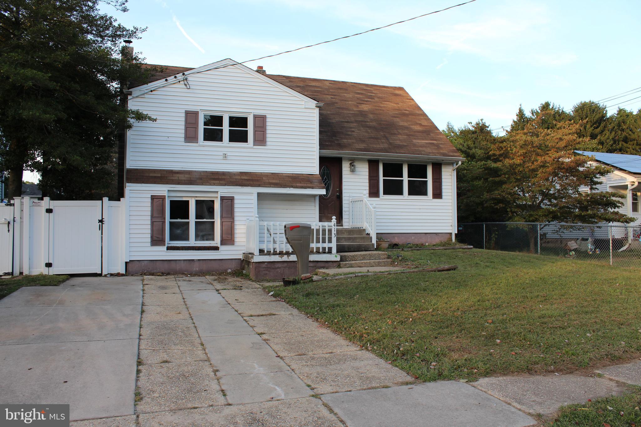 413 Dickinson Road Glassboro, NJ 08028 - Photo 2 of 16 a front view of a house with a yard