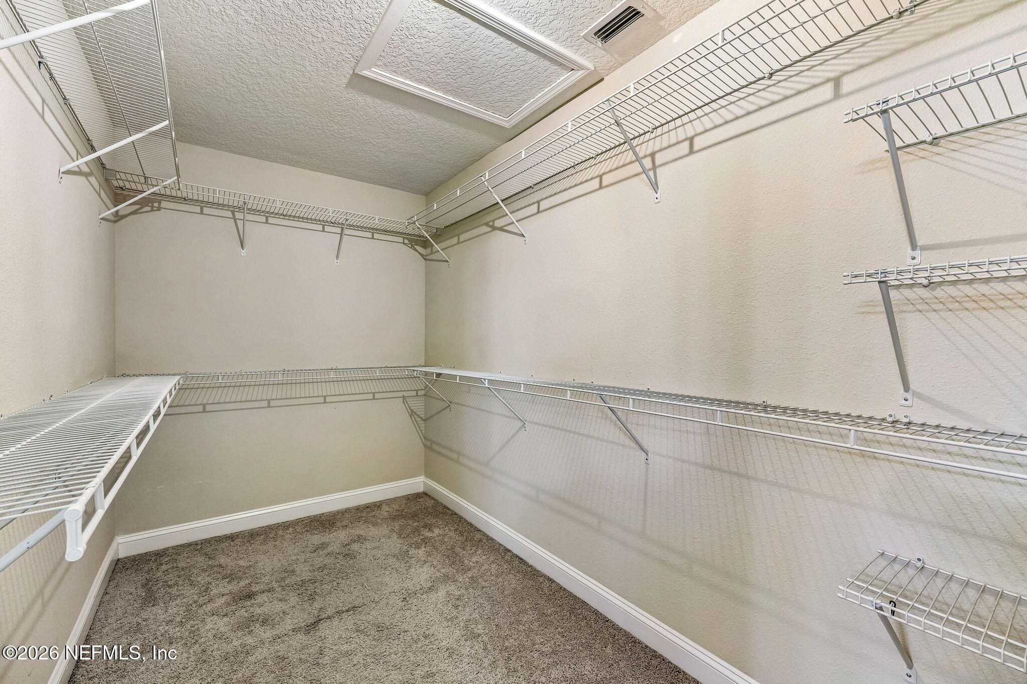 12198 Ridge Crossing Way Jacksonville, FL 32226 - Photo 30 of 67 a view of a room with racks on the wall