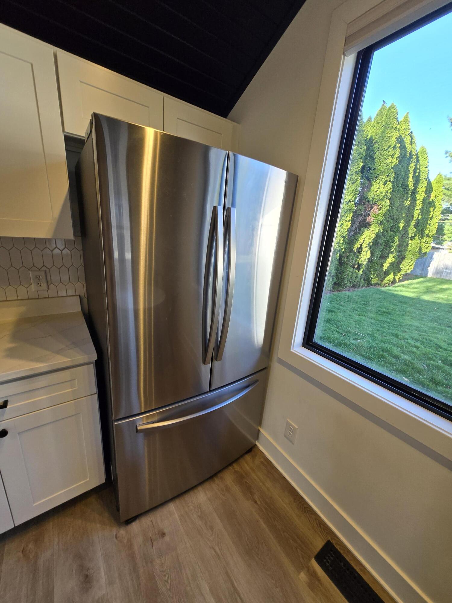 506 Locust Street Valparaiso, IN 46383 - Photo 11 of 34 a view of a refrigerator in kitchen and window