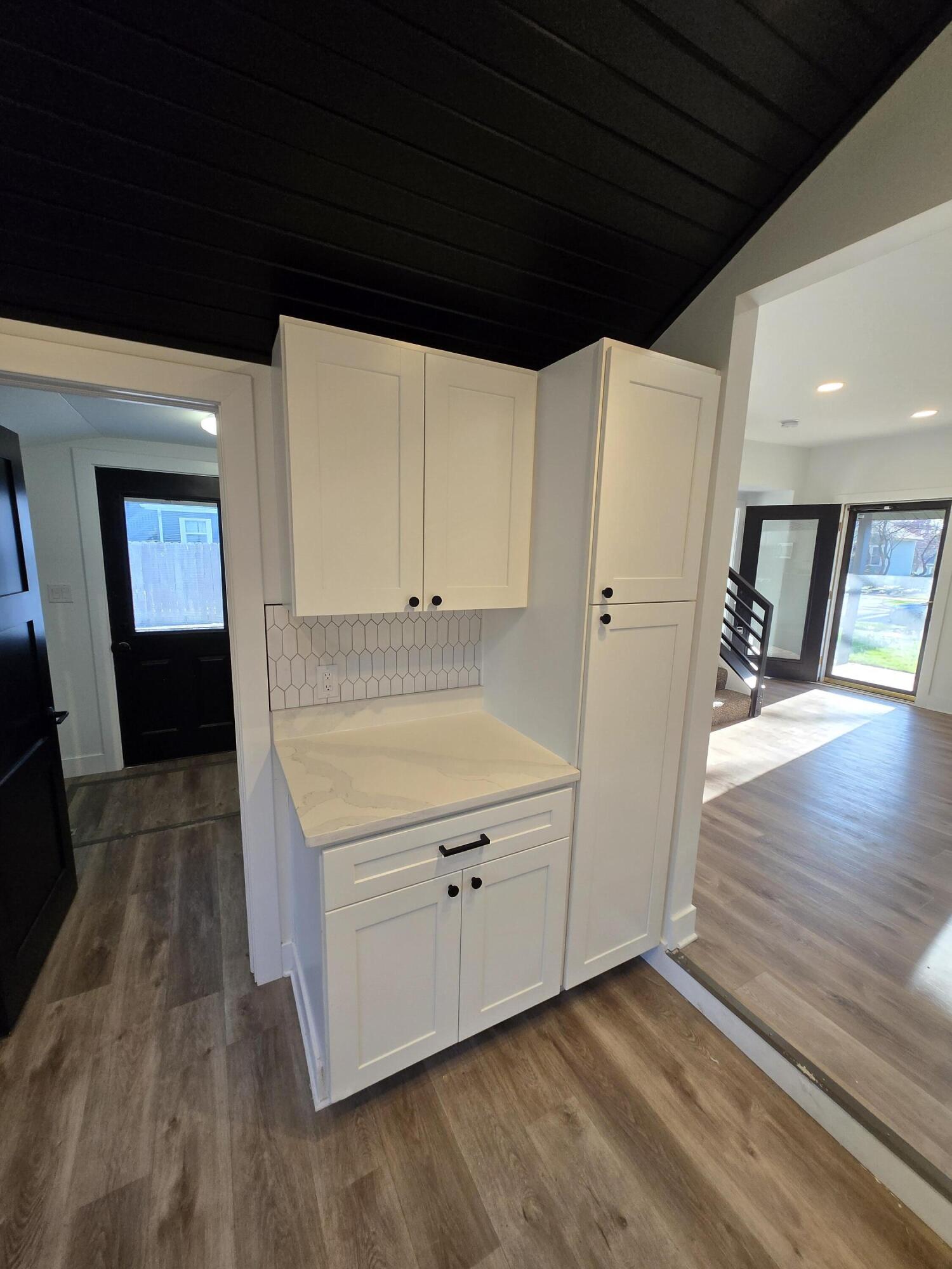 506 Locust Street Valparaiso, IN 46383 - Photo 12 of 34 a kitchen with a refrigerator a stove and wooden floor
