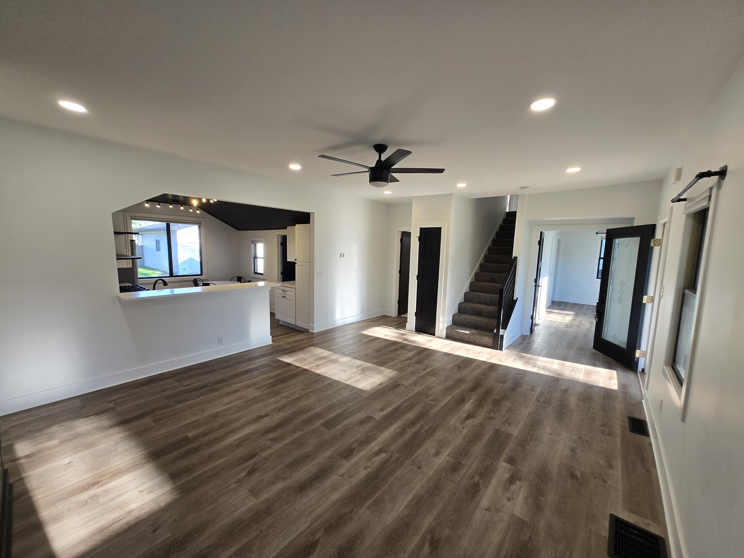 506 Locust Street Valparaiso, IN 46383 - Photo 6 of 34 a view of a living room with wooden floor and a ceiling fan