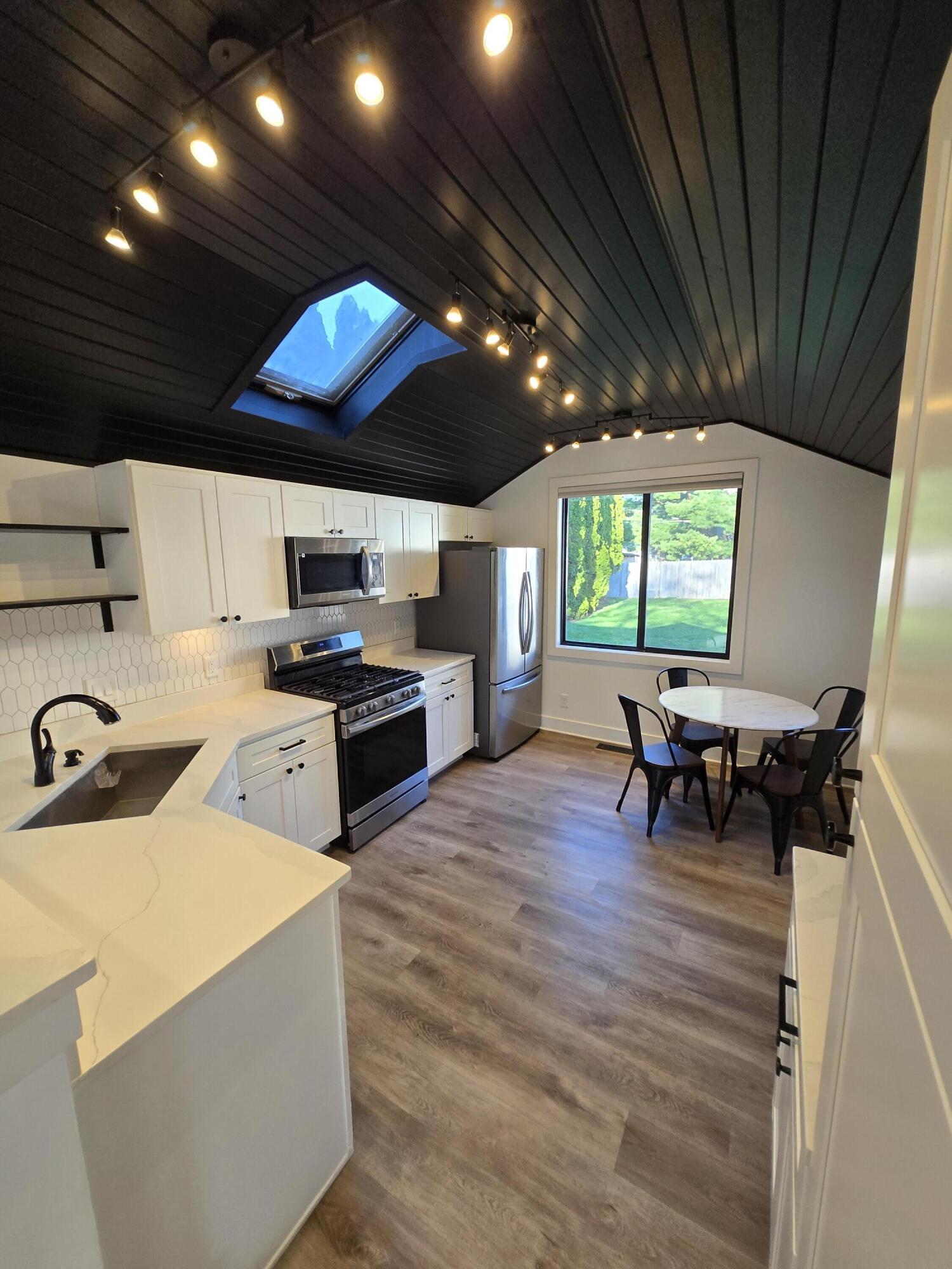506 Locust Street Valparaiso, IN 46383 - Photo 8 of 34 a kitchen with a stove and a refrigerator