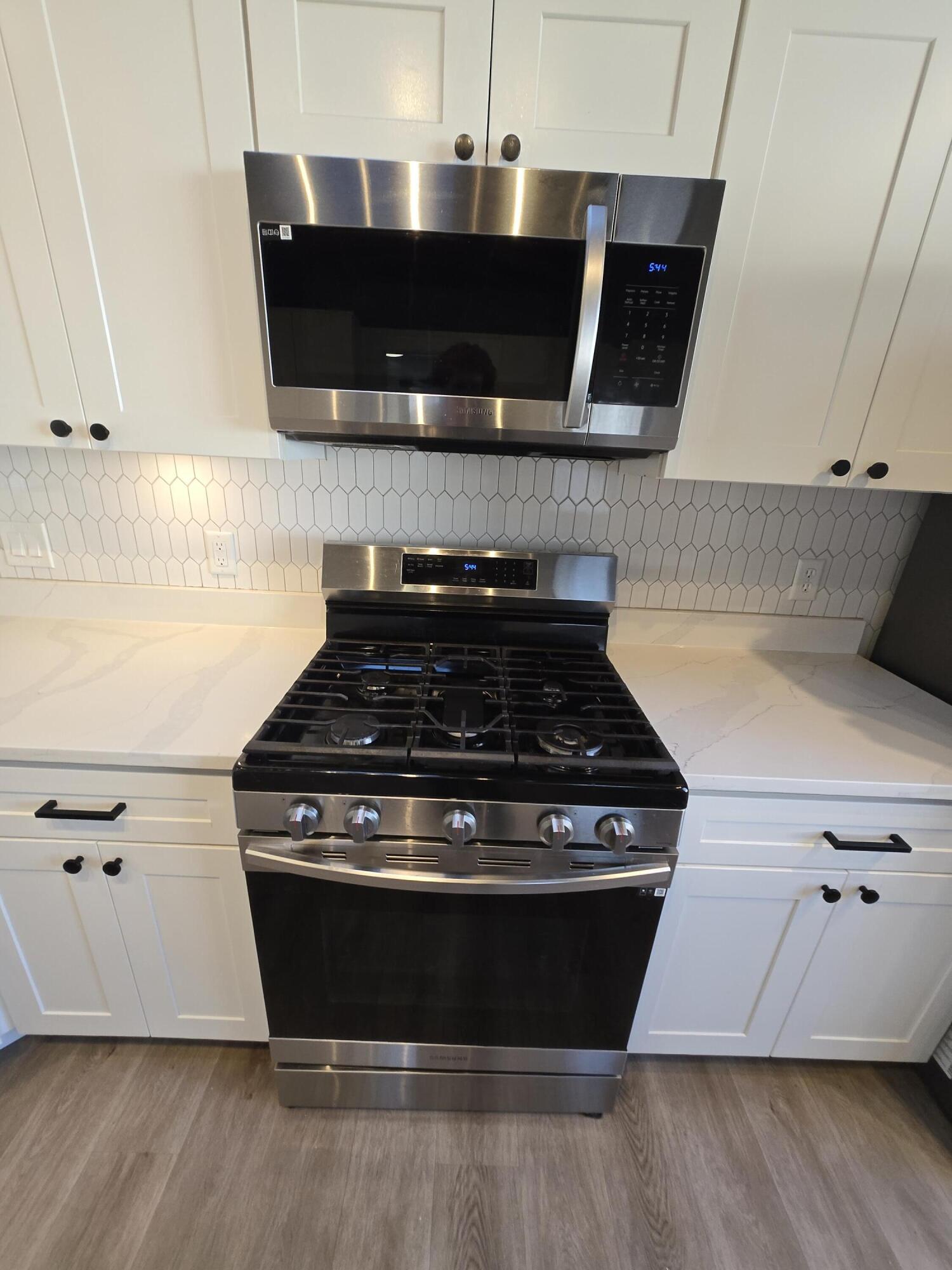 506 Locust Street Valparaiso, IN 46383 - Photo 10 of 34 a stove top oven sitting inside of a kitchen