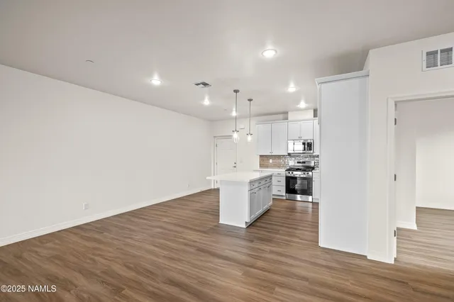 a view of kitchen with wooden floor