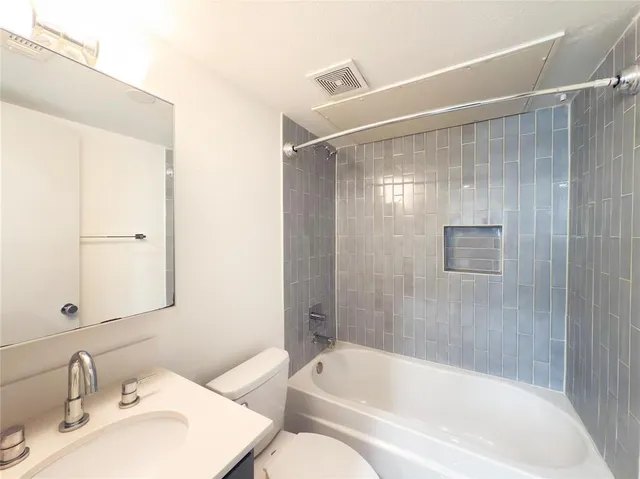 a bathroom with a bathtub and a sink