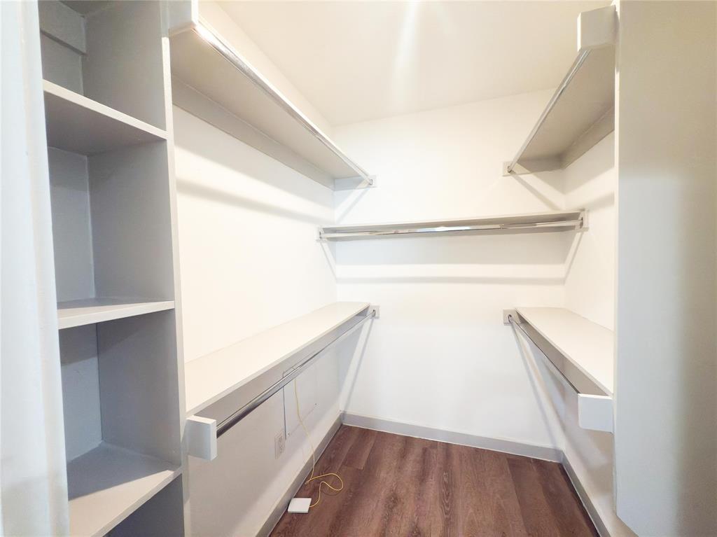 4526 Munger Avenue, Unit 208 Dallas, TX 75204 - Photo 14 of 19 a view of closet with wooden floor