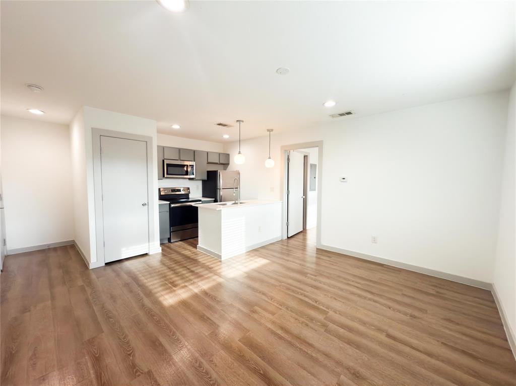 4526 Munger Avenue, Unit 208 Dallas, TX 75204 - Photo 6 of 19 a view of kitchen with wooden floor