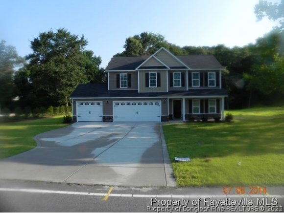 2651 Rockfish Road Raeford, NC 28376 - Photo 1 of 21 a front view of a house with a yard