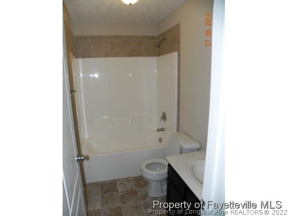 2651 Rockfish Road Raeford, NC 28376 - Photo 13 of 21 a bathroom with a toilet and a shower