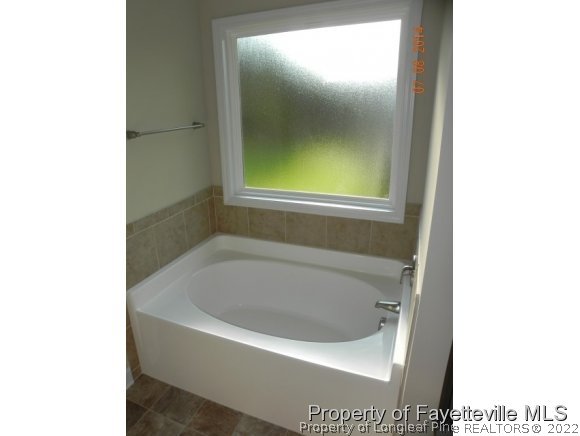 2651 Rockfish Road Raeford, NC 28376 - Photo 20 of 21 a white bath tub sitting in a bathroom