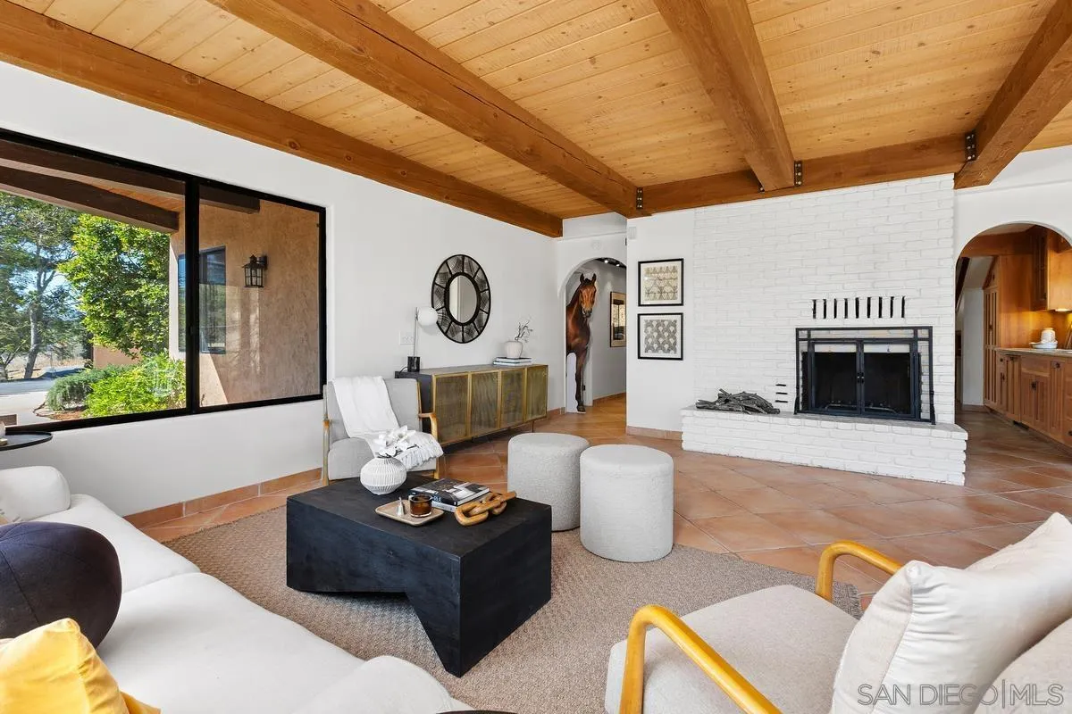 974 Via Hillview Fallbrook, CA 92028 - Photo 3 of 43 a living room with furniture and a fireplace