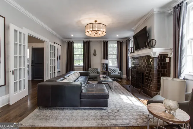 a kitchen with stainless steel appliances granite countertop a stove and a large window
