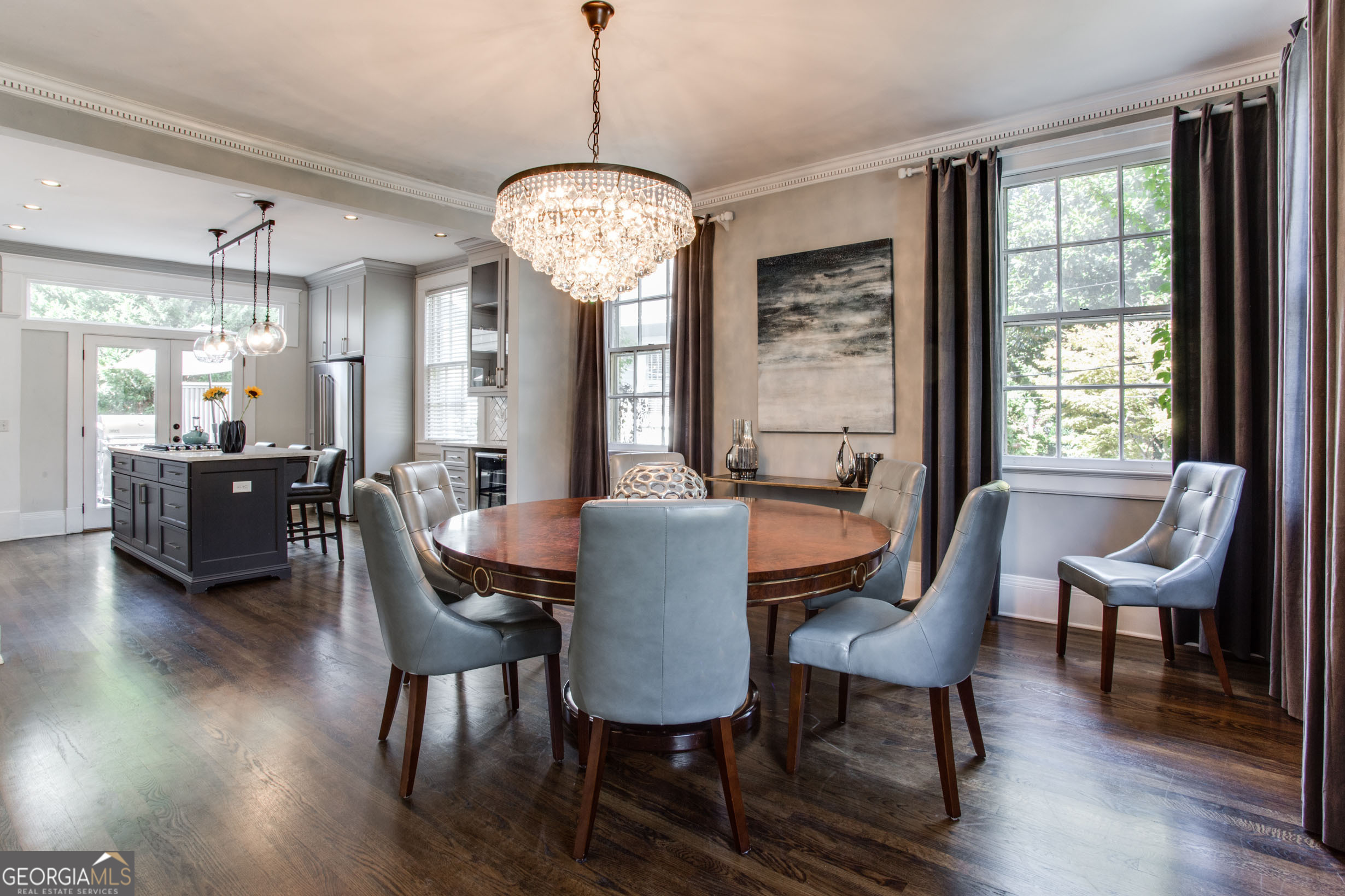 524 Seminole Avenue Northeast Atlanta, GA 30307 - Photo 17 of 75 a view of a dining room with furniture a chandelier and wooden floor