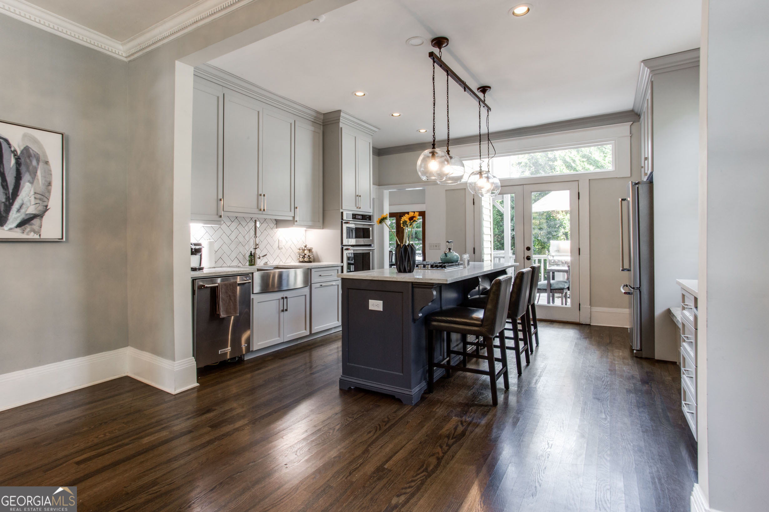 524 Seminole Avenue Northeast Atlanta, GA 30307 - Photo 19 of 75 a kitchen with stainless steel appliances a dining table chairs stove and wooden floor