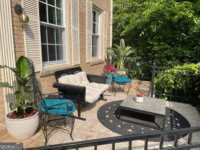 a backyard of a house with lots of green space and a fountain