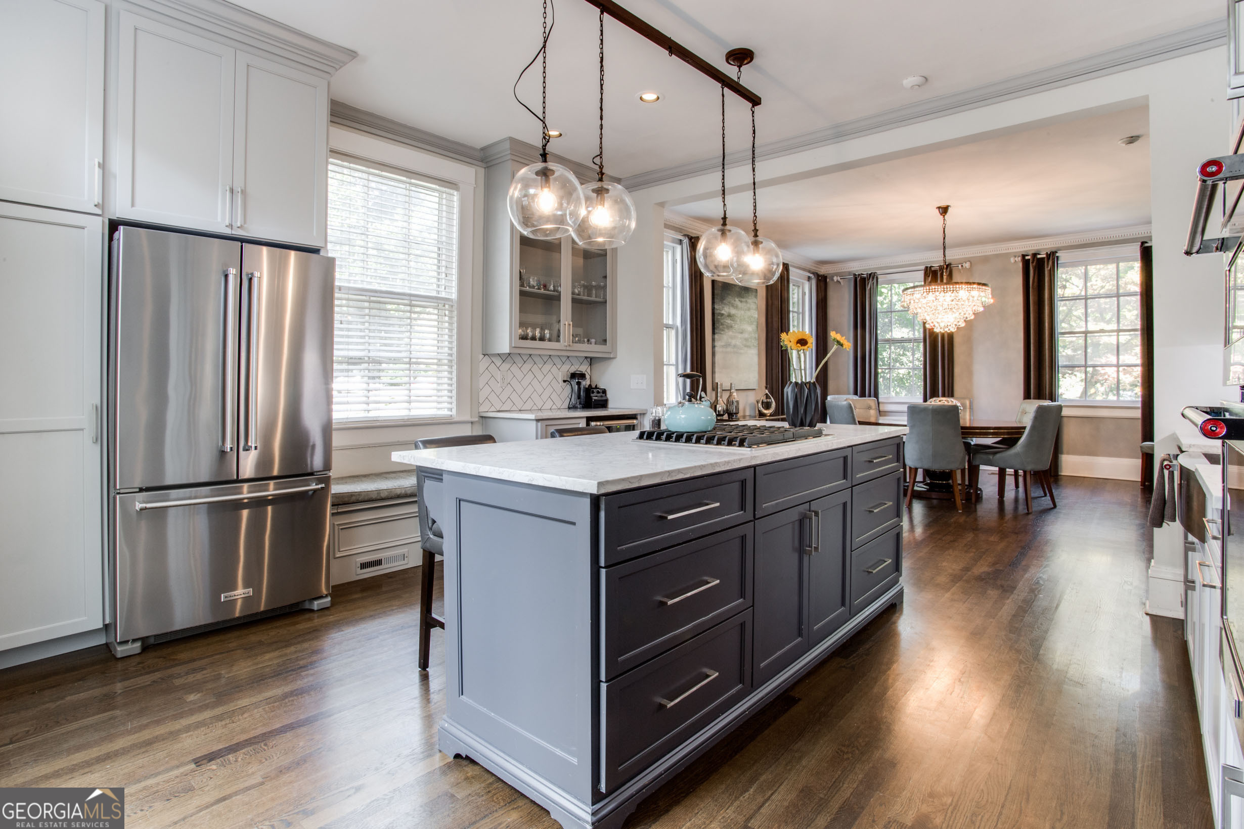 524 Seminole Avenue Northeast Atlanta, GA 30307 - Photo 22 of 75 a kitchen with stainless steel appliances granite countertop a refrigerator a sink dishwasher a stove and a dining table with wooden floor