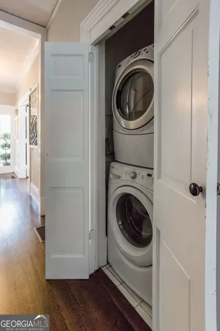 a bedroom with a bed and a mirror