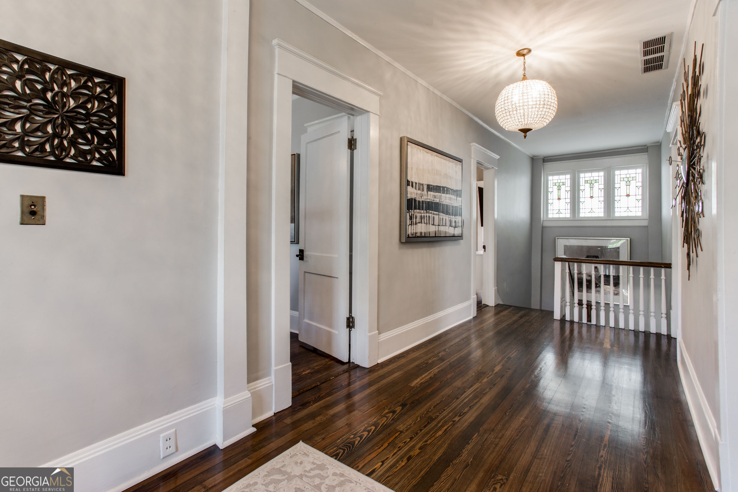 524 Seminole Avenue Northeast Atlanta, GA 30307 - Photo 29 of 75 a view of a hallway with wooden floor and a large window