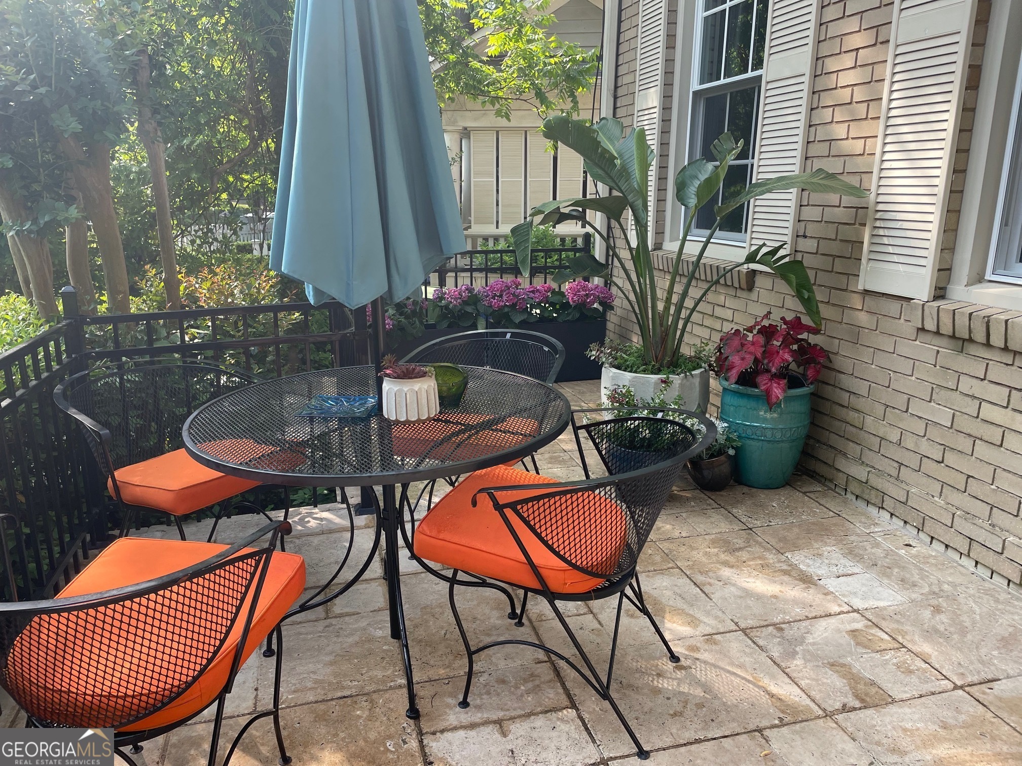 524 Seminole Avenue Northeast Atlanta, GA 30307 - Photo 3 of 75 a backyard of a house with barbeque oven table and chairs