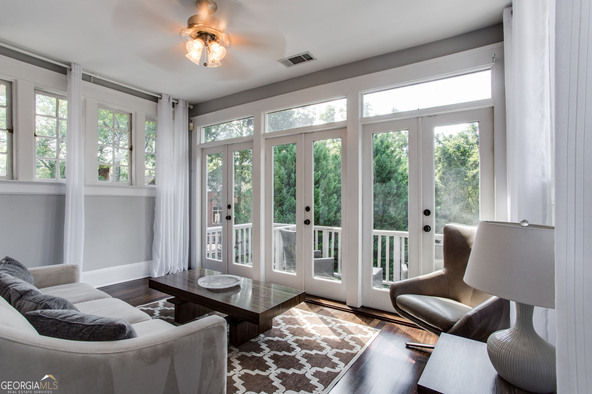 524 Seminole Avenue Northeast Atlanta, GA 30307 - Photo 33 of 75 a living room with furniture and a floor to ceiling window