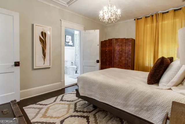 a view of a dining room with furniture and a chandelier