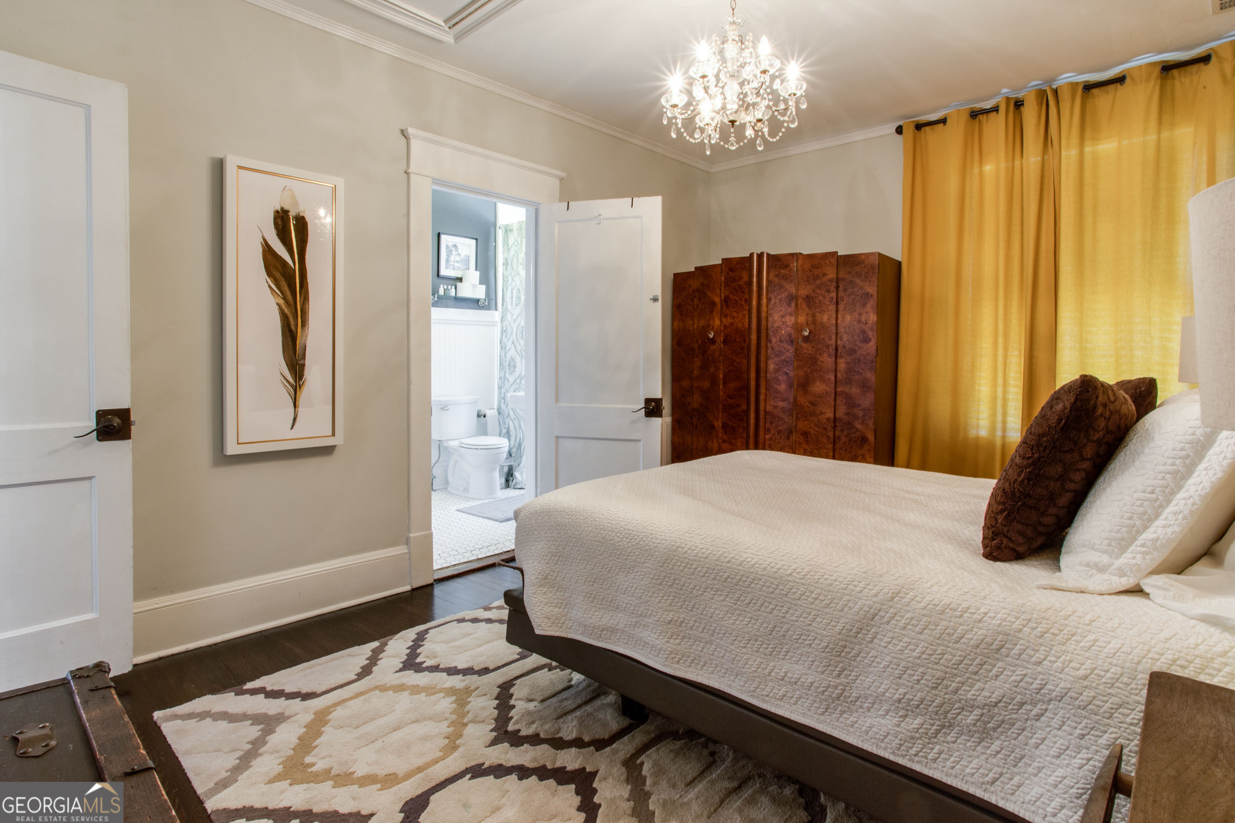 524 Seminole Avenue Northeast Atlanta, GA 30307 - Photo 35 of 75 a bedroom with a bed and wooden floor