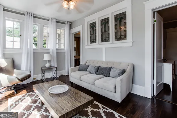 a view of balcony with furniture and wooden floor