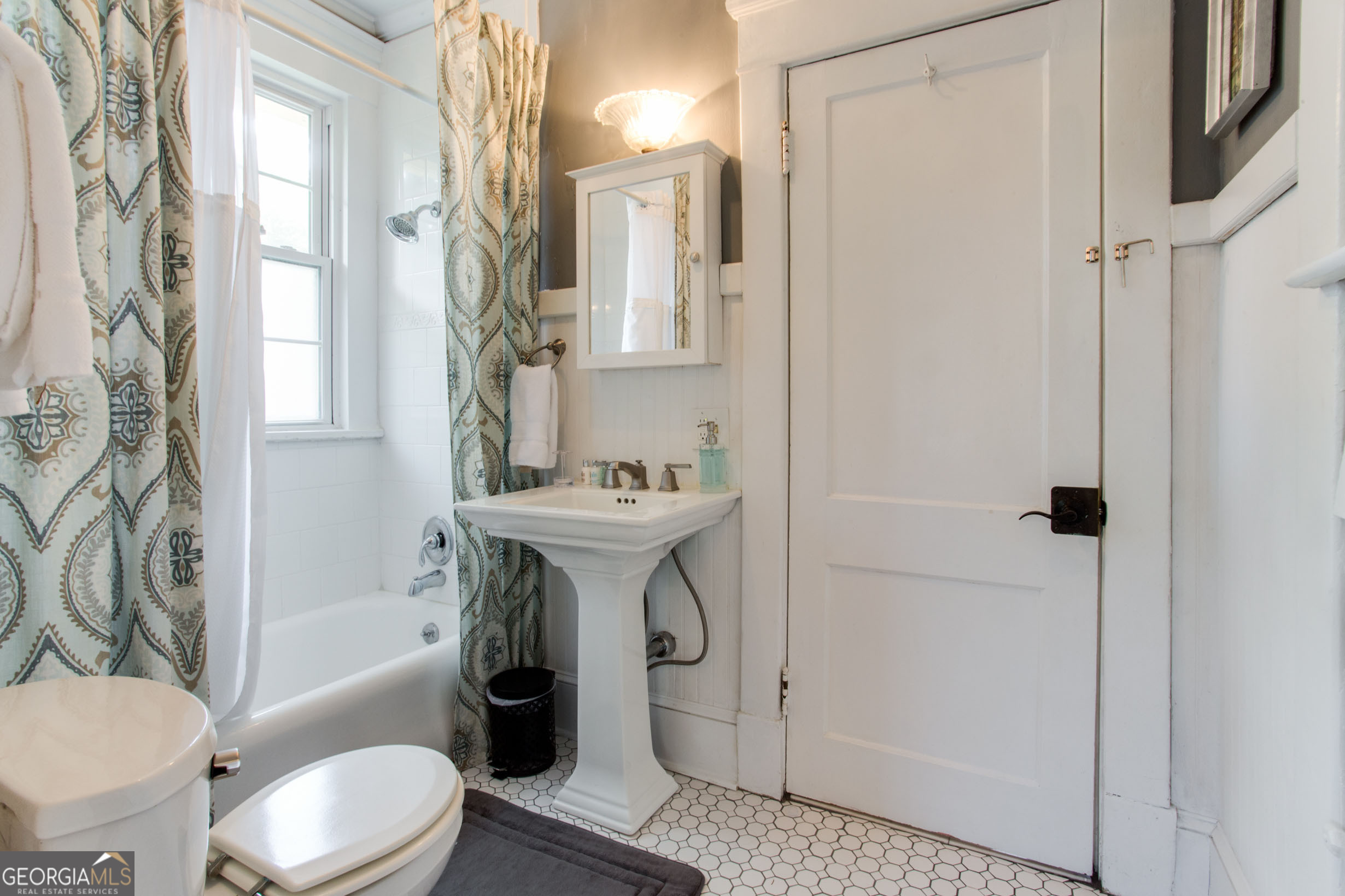 524 Seminole Avenue Northeast Atlanta, GA 30307 - Photo 44 of 75 a bathroom with a granite countertop toilet sink and shower