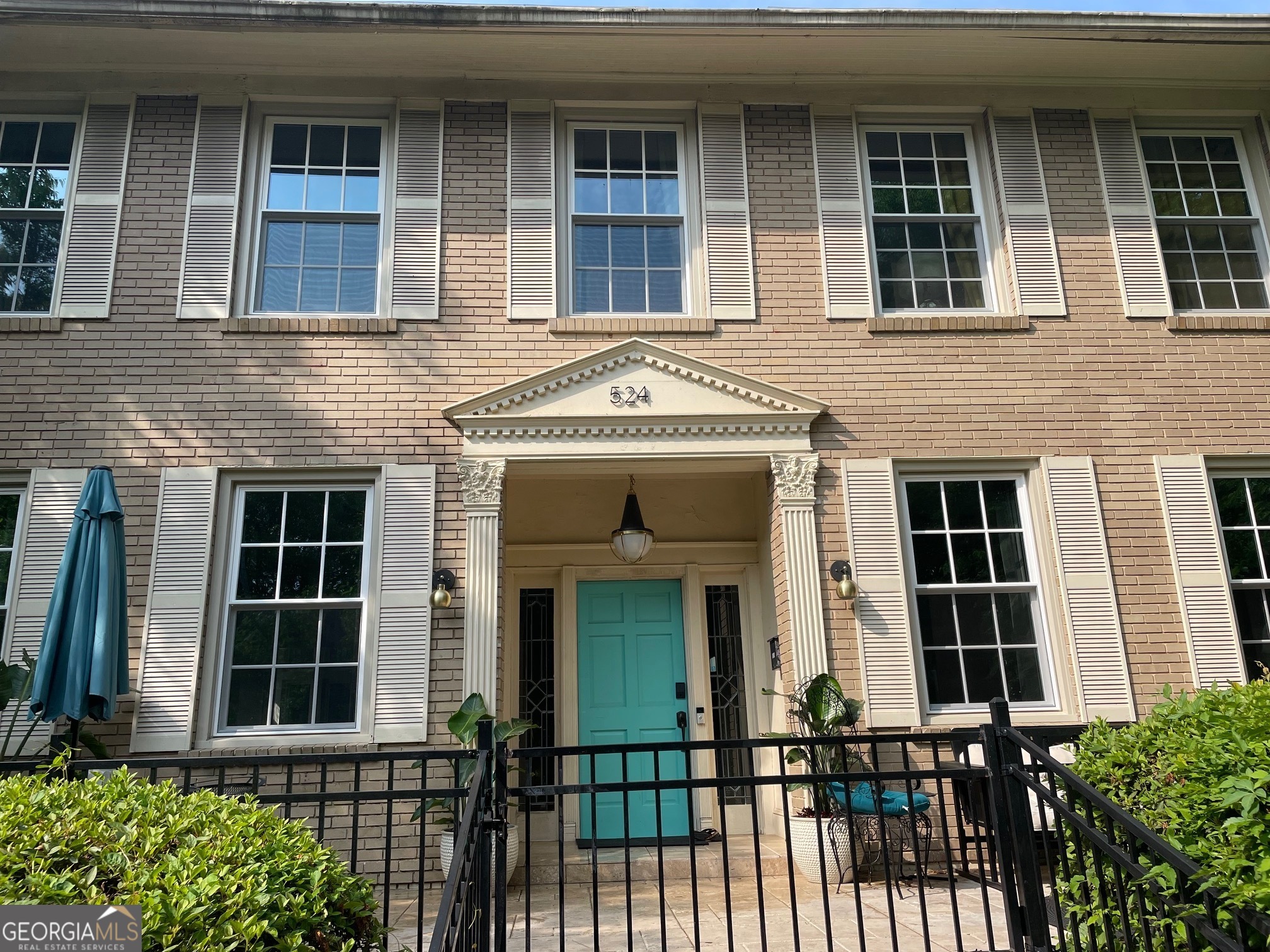 524 Seminole Avenue Northeast Atlanta, GA 30307 - Photo 5 of 75 a view of a brick house with large windows
