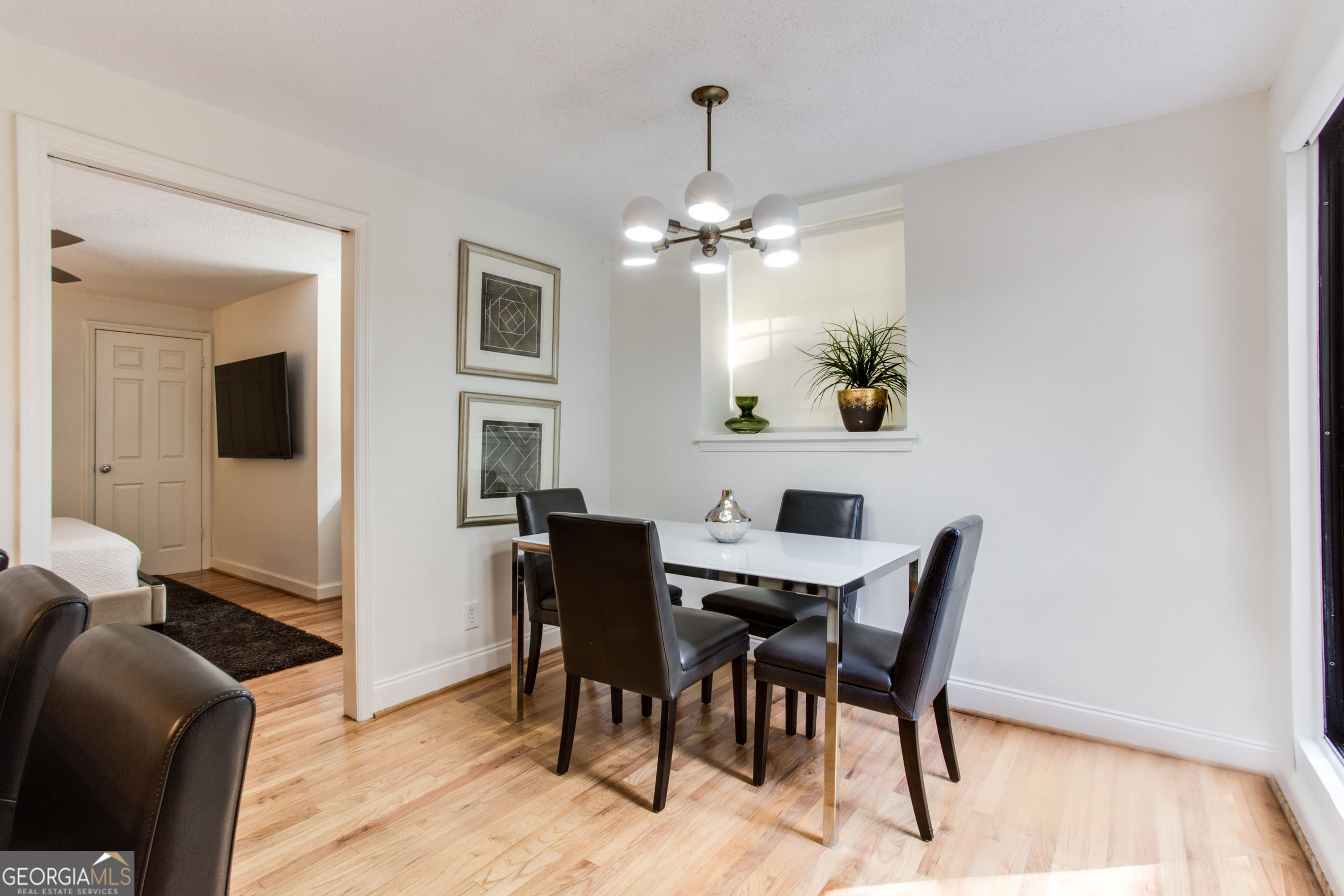 524 Seminole Avenue Northeast Atlanta, GA 30307 - Photo 52 of 75 a view of a dining room with furniture and a chandelier