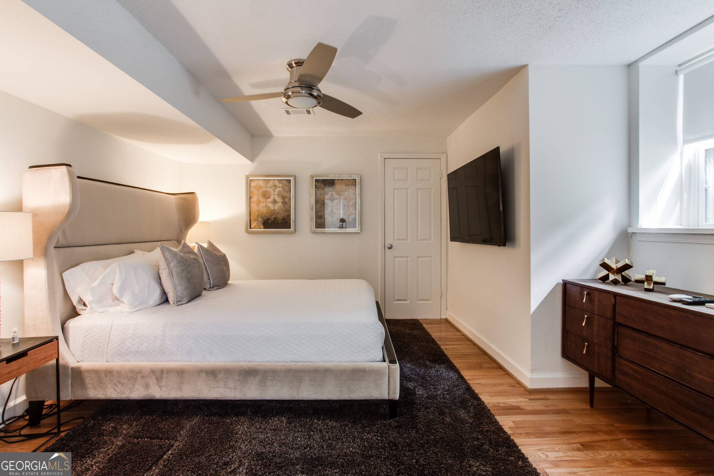 524 Seminole Avenue Northeast Atlanta, GA 30307 - Photo 54 of 75 a bedroom with a bed and a flat screen tv