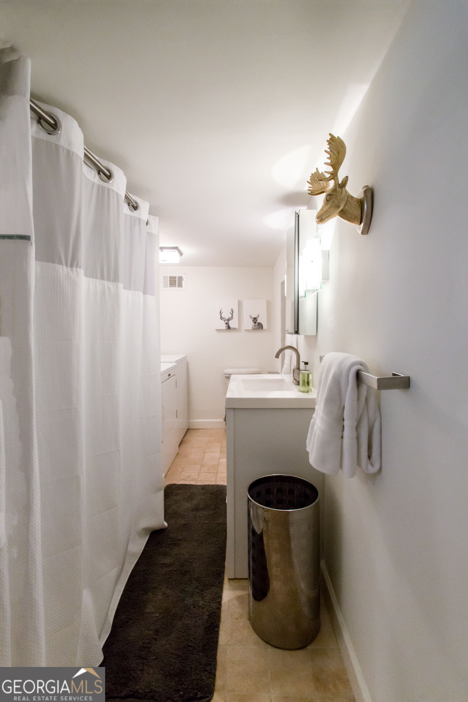 524 Seminole Avenue Northeast Atlanta, GA 30307 - Photo 56 of 75 a bathroom with a sink and mirror