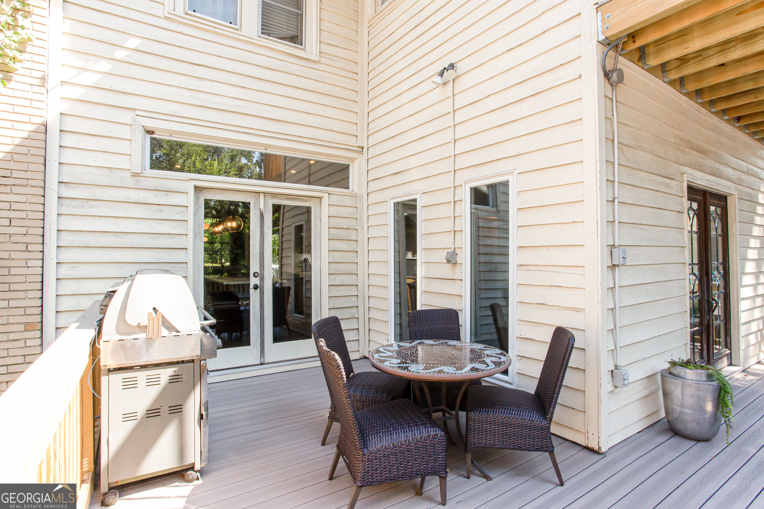 524 Seminole Avenue Northeast Atlanta, GA 30307 - Photo 63 of 75 a view of a patio with table and chairs and wooden floor