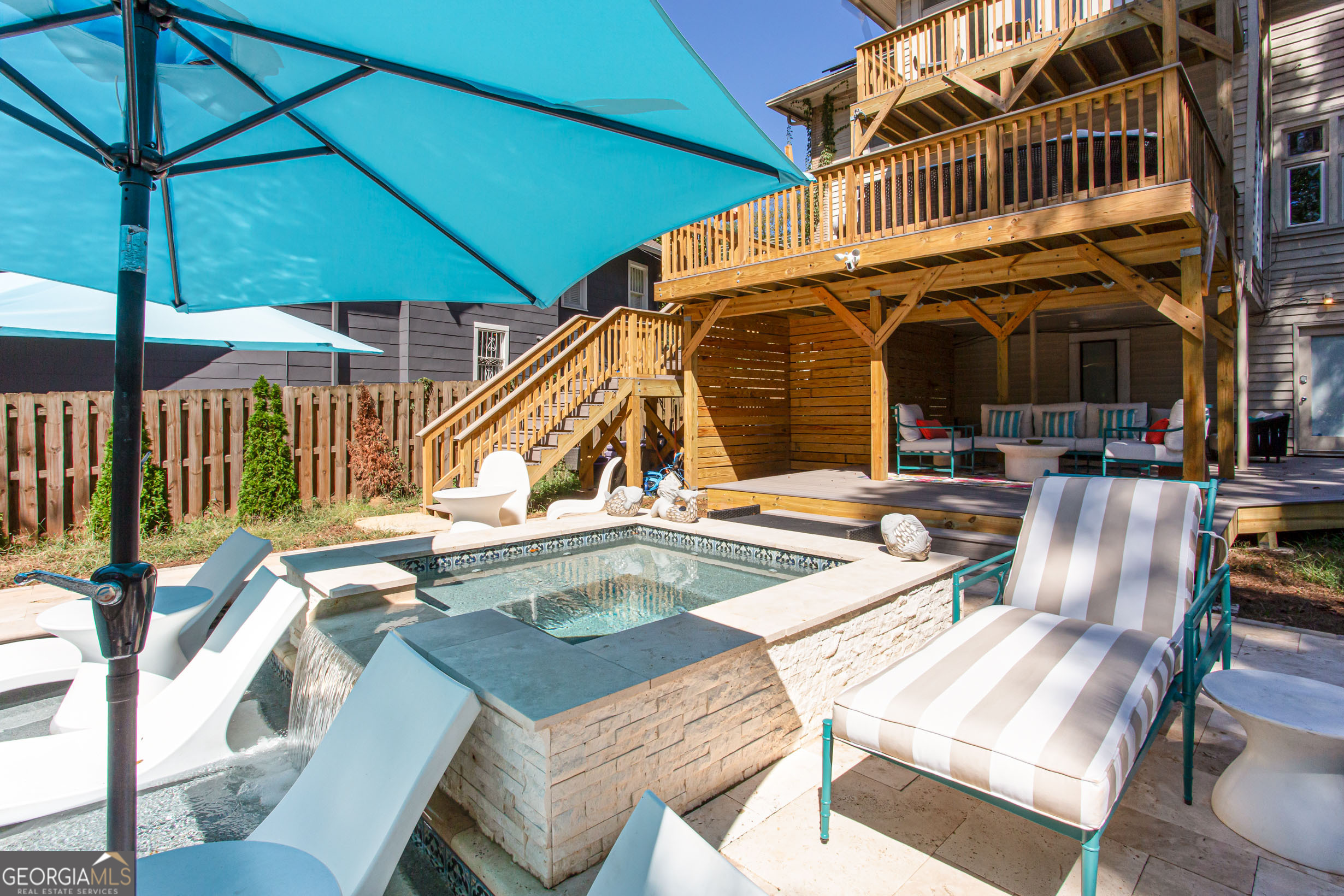 524 Seminole Avenue Northeast Atlanta, GA 30307 - Photo 71 of 75 a view of a patio with table and chairs under an umbrella