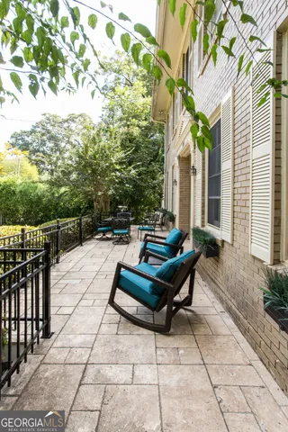 a living room with furniture fireplace and a flat screen tv