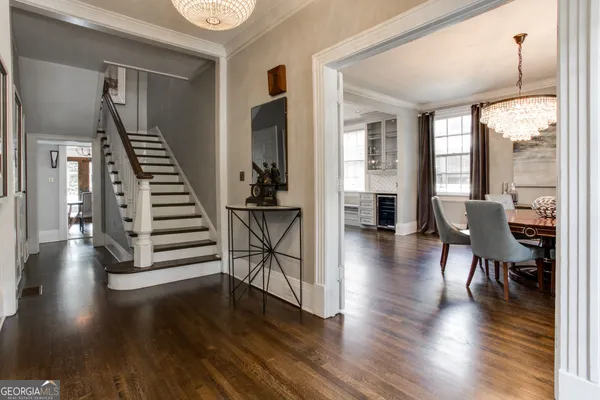a view of a dining room with furniture window and wooden floor