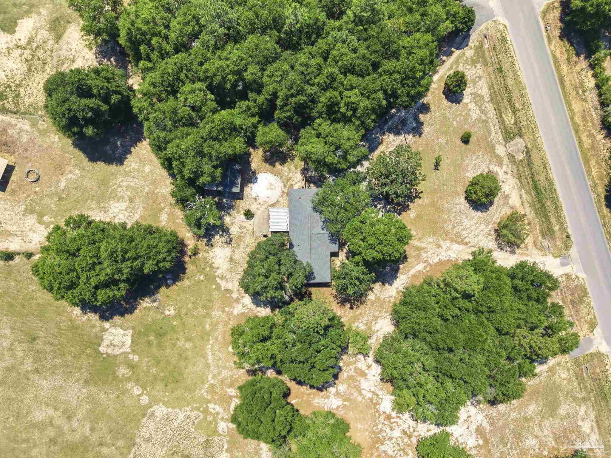 5121 Keyser Mill Road Baker, FL 32531 - Photo 42 of 52 an aerial view of a house with a yard and plants
