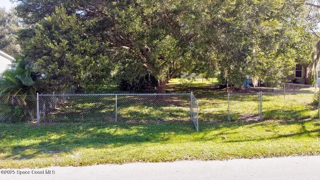 a view of swimming pool with a yard