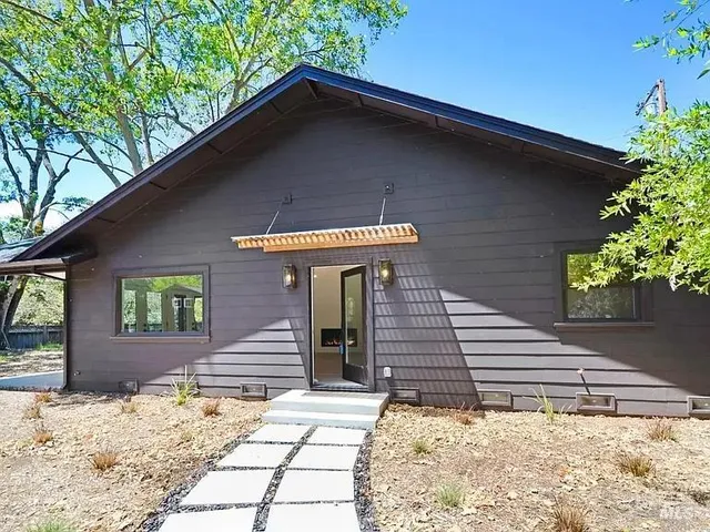 a front view of a house with a yard