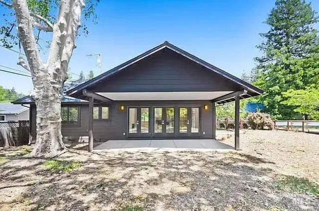 a front view of a house with a yard