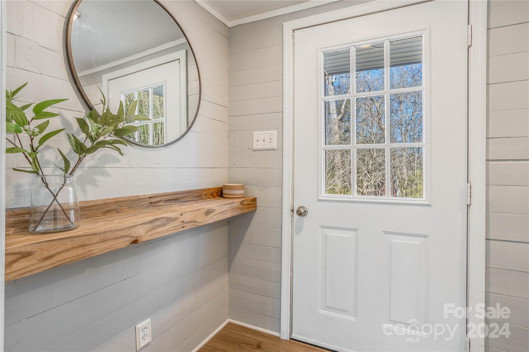 410 Holly Hills Road Dallas, NC 28034 - Photo 18 of 27 a bathroom with a granite countertop sink a mirror and a window