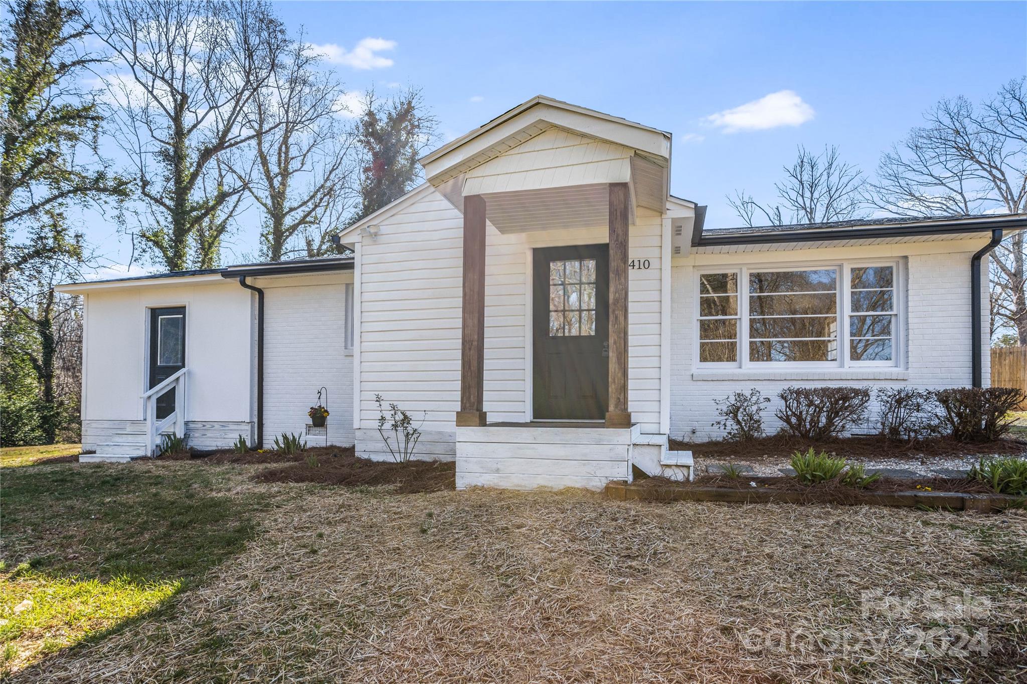 410 Holly Hills Road Dallas, NC 28034 - Photo 2 of 27 a front view of a house with a yard