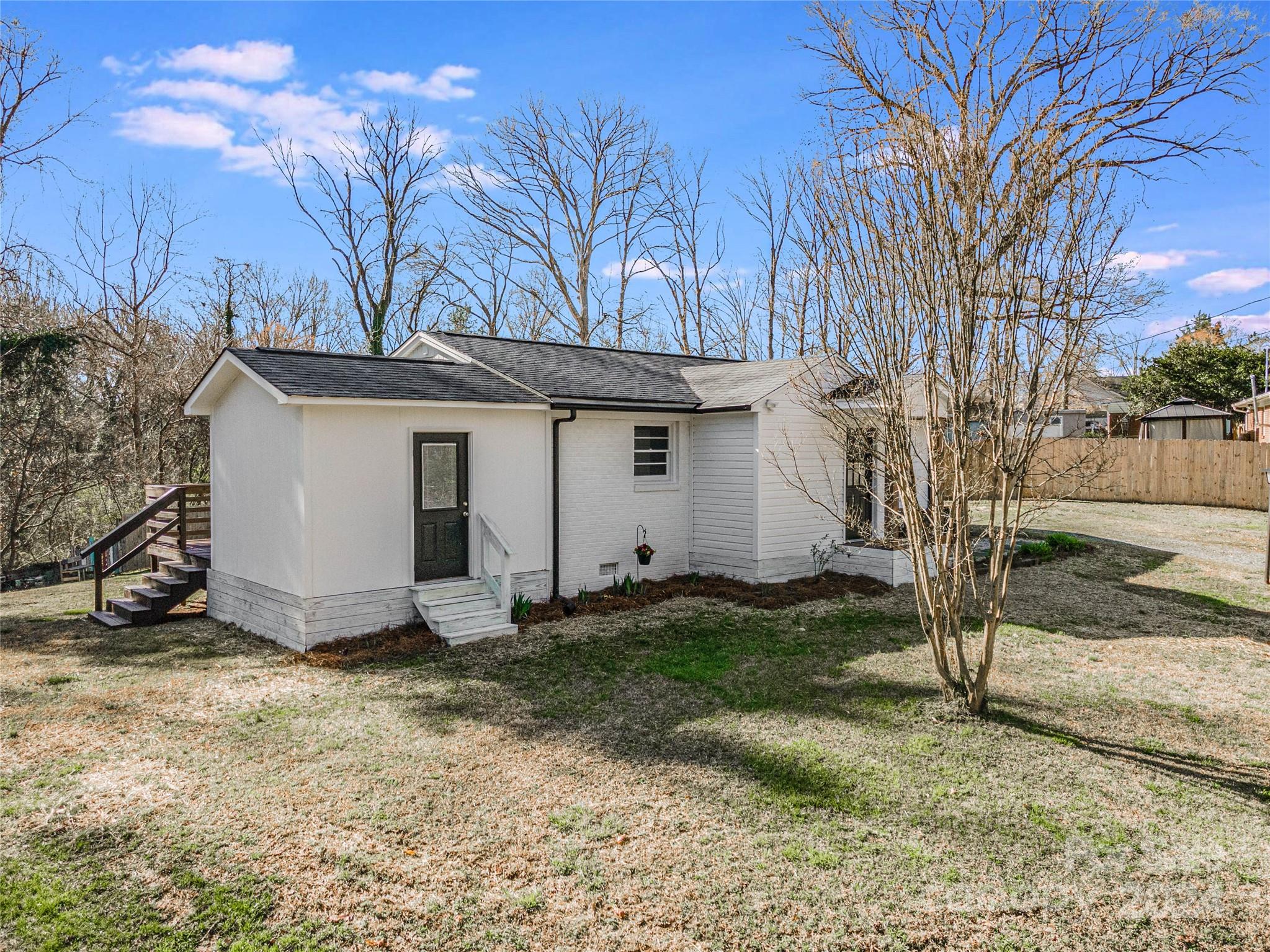 410 Holly Hills Road Dallas, NC 28034 - Photo 22 of 27 a view of a barn with a yard